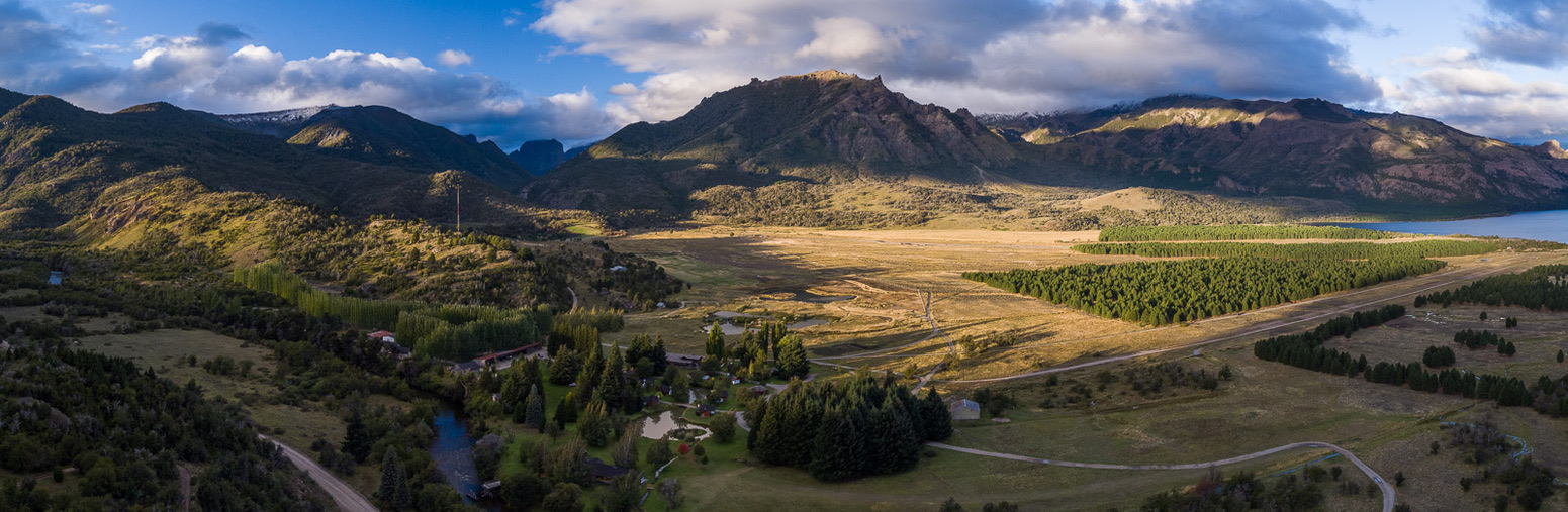 Aerial view of the Parque Diana ranch, lodge and river below the Andean foothills