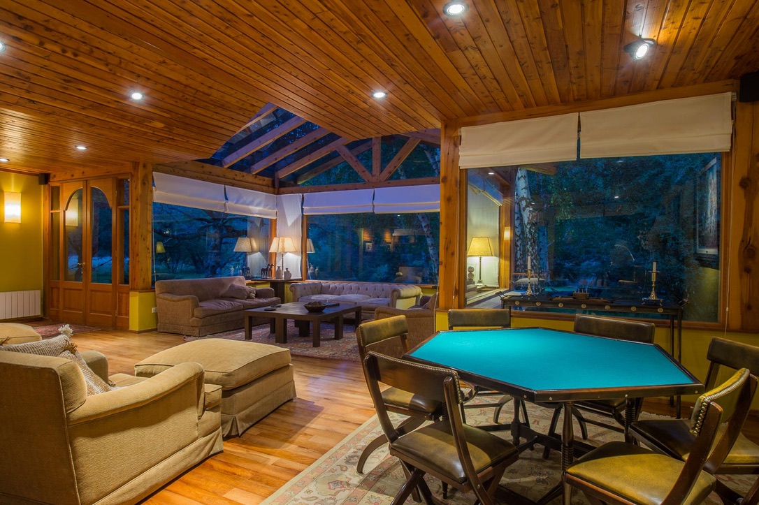 Card room and lounge at Parque Diana lodge at dusk