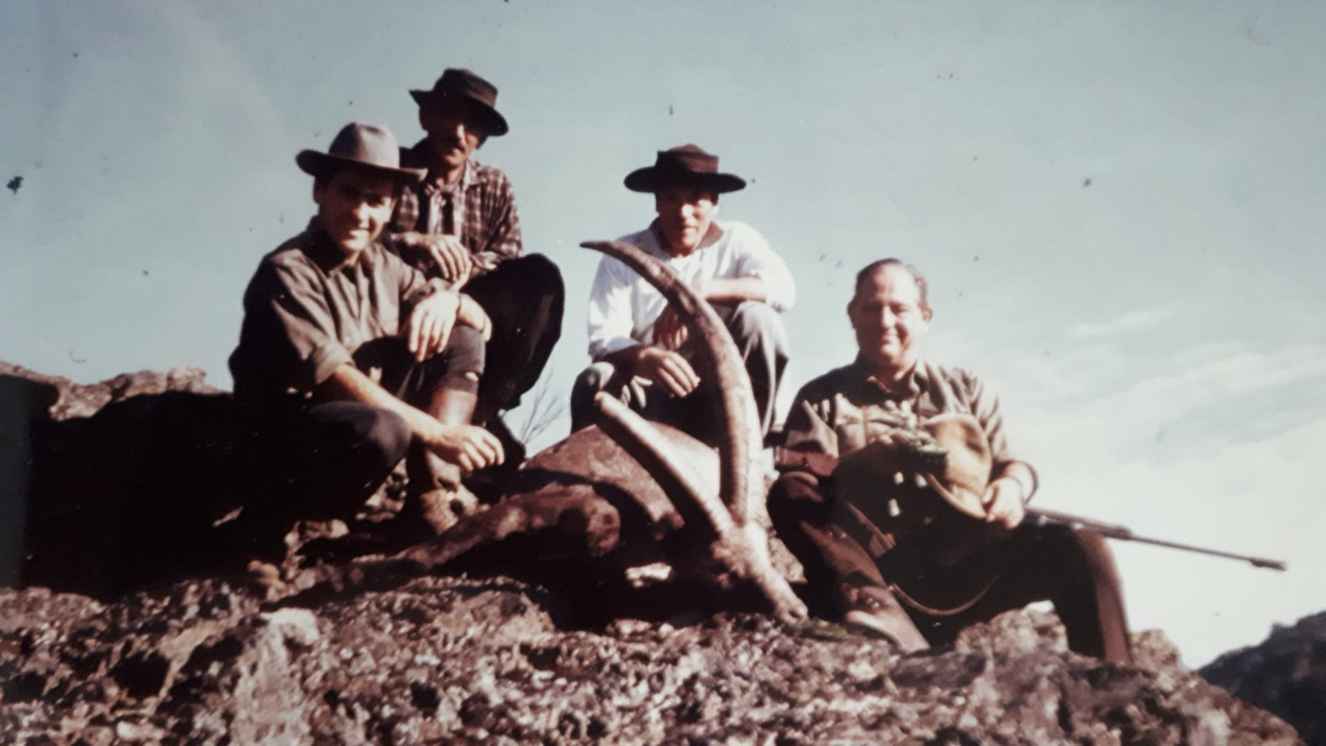 Archival colour photograph of the Parque Diana family and guides on the mountain with one of the first Alpine ibex on the mountain