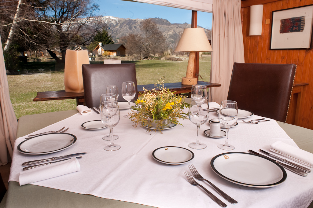 Table set for dinner at Parque Diana with mountain views through the window